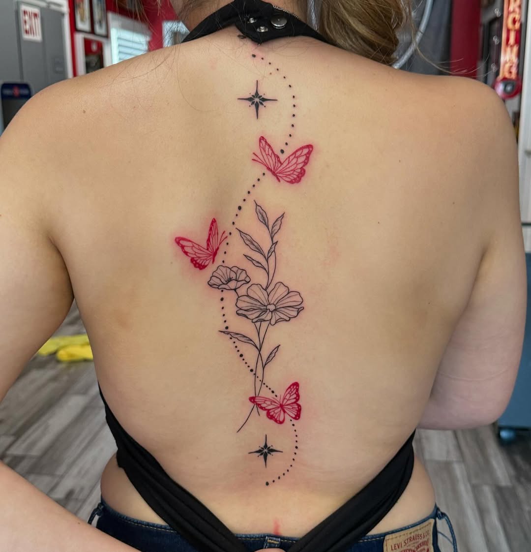 Elegant spine tattoo with butterflies and flowers