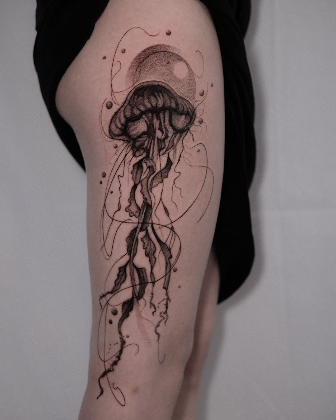 Elegant jellyfish tattoo flowing with grace