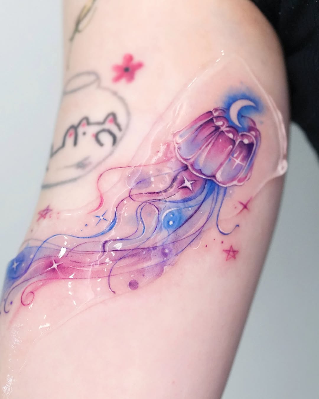 Colorful jellyfish tattoo with dreamy vibes