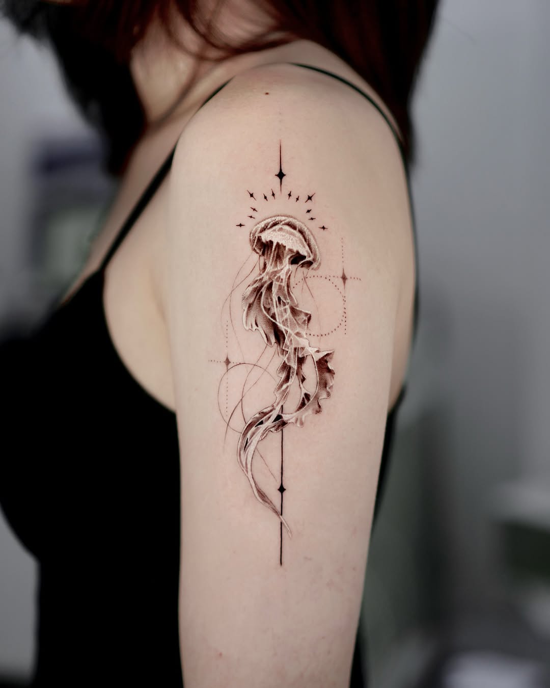 Elegant jellyfish tattoo with geometric accents