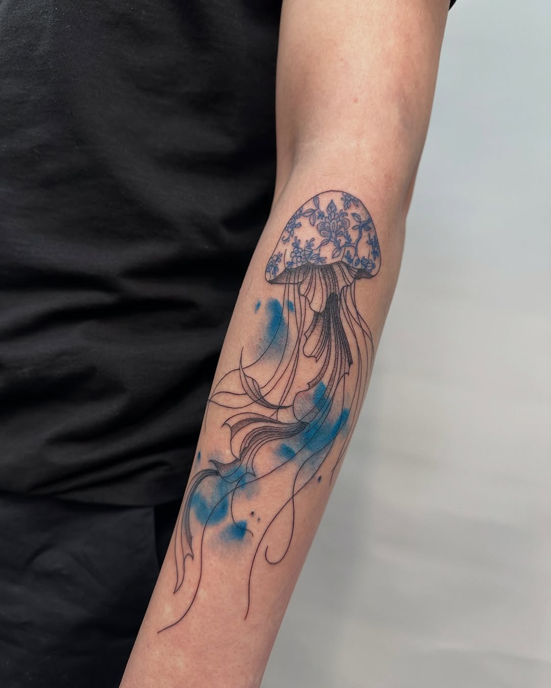 Elegant jellyfish tattoo with flowing effects