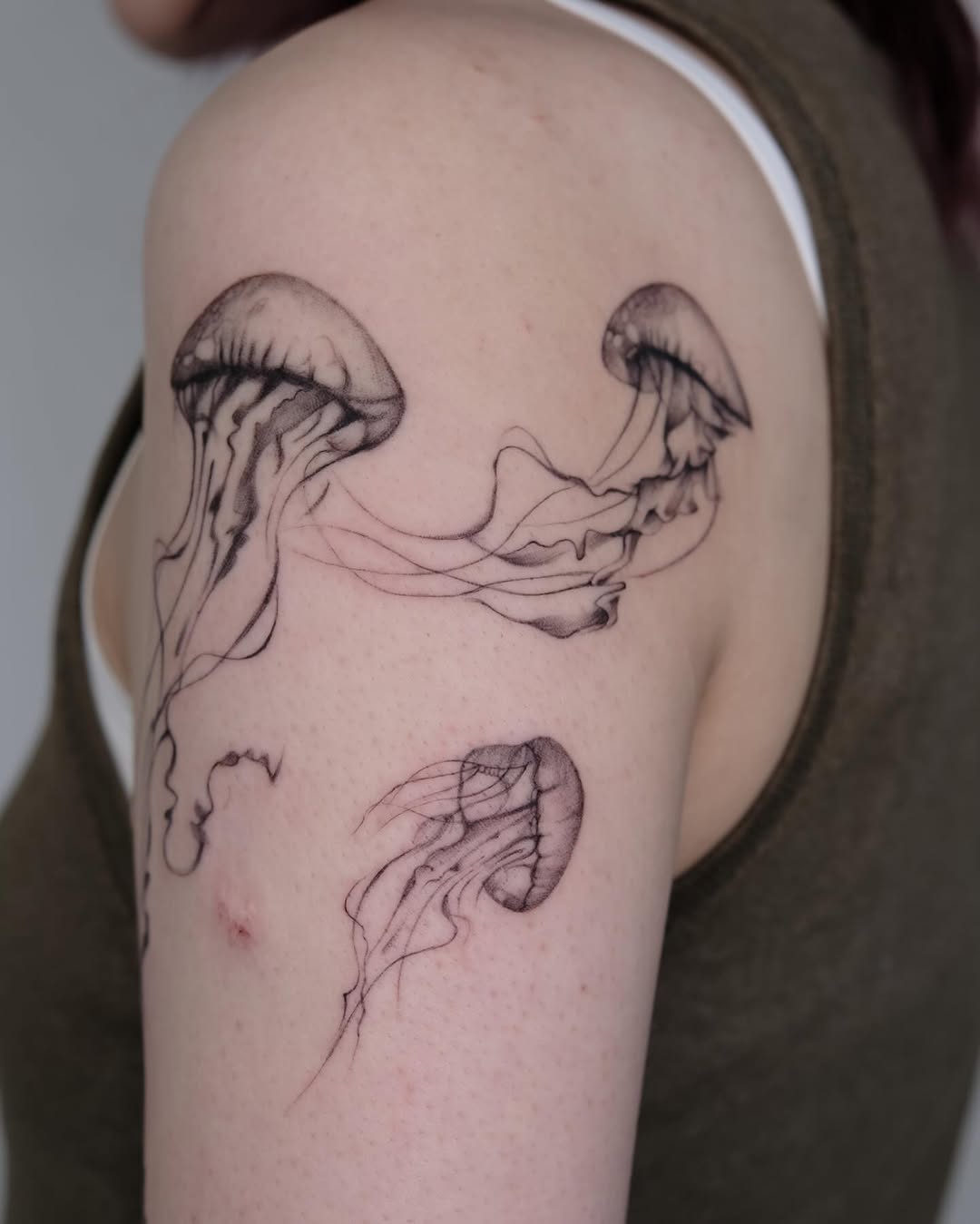 Elegant Jellyfish Tattoo on Upper Arm