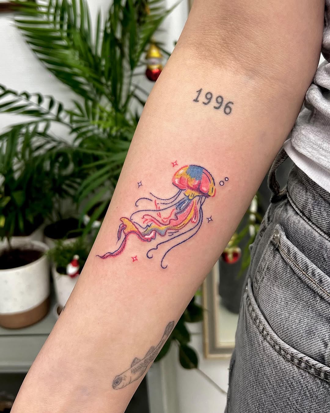Vibrant jellyfish tattoo with playful details