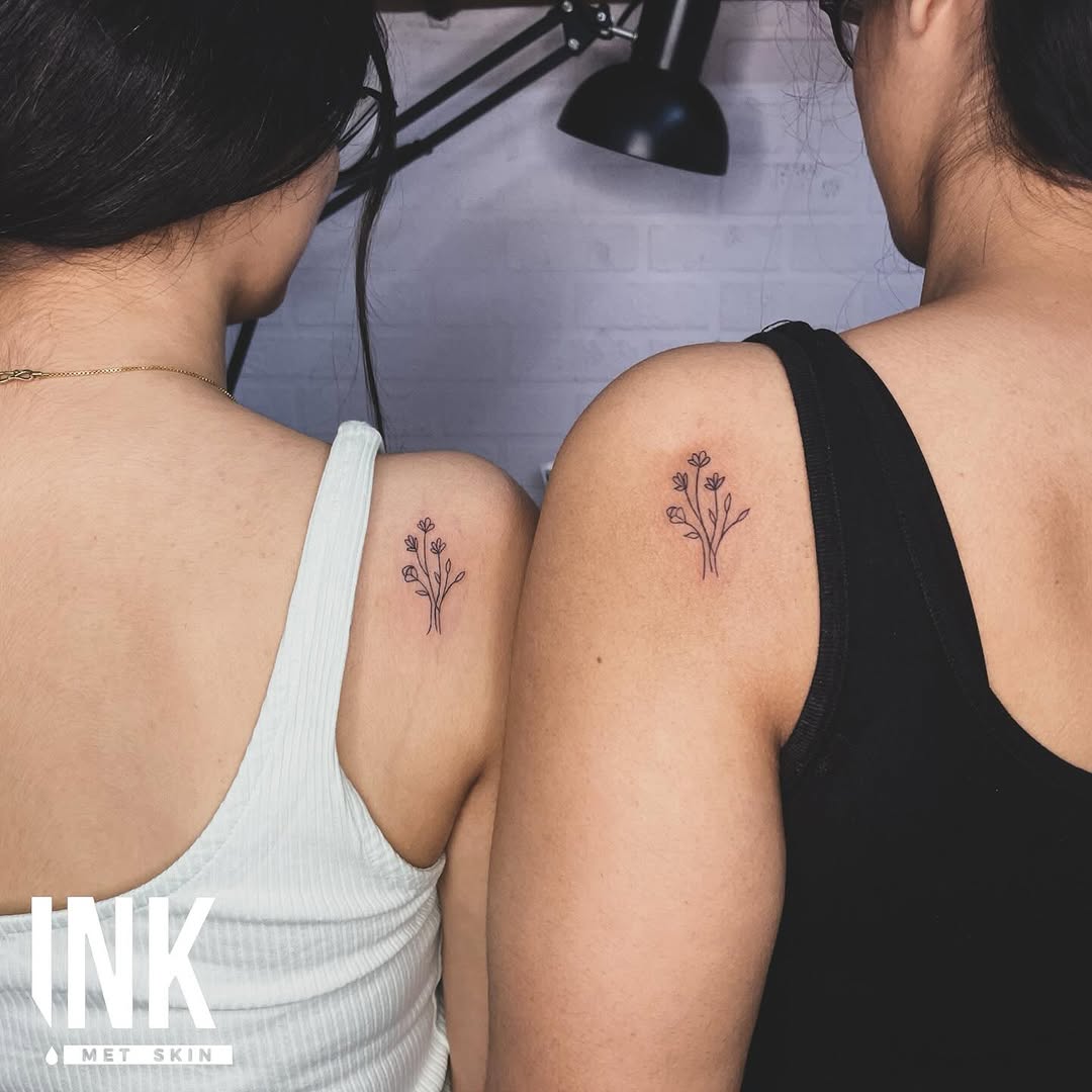 Delicate floral tattoos symbolizing sibling bonds