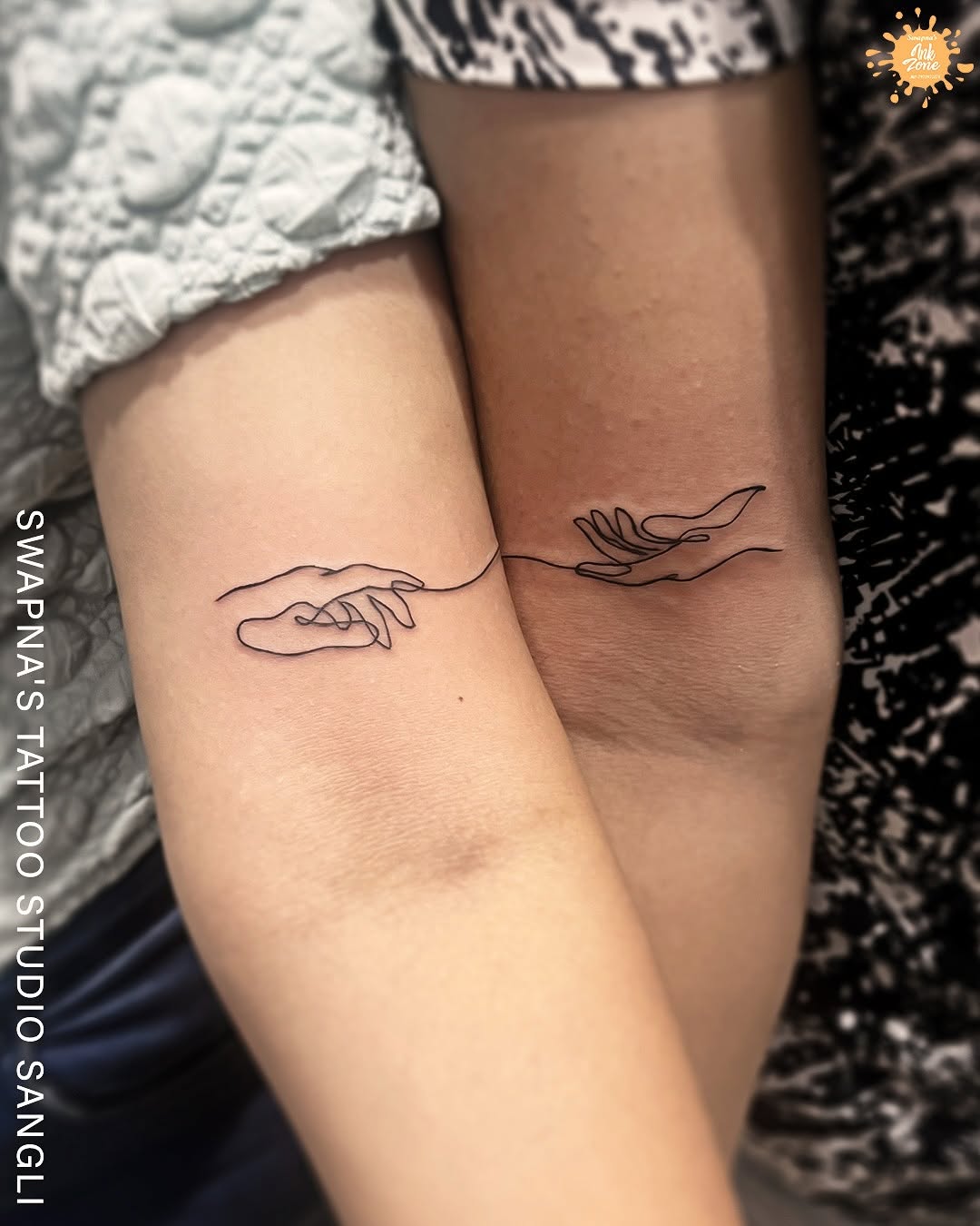 Elegant sibling connection through minimalist tattoo design