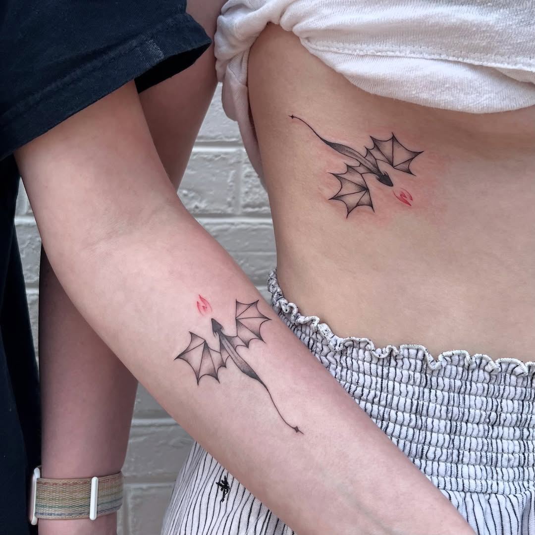 Dynamic sibling tattoos featuring ethereal dragon designs.