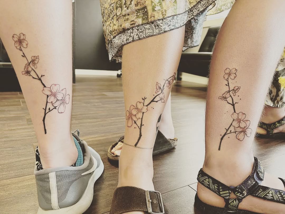 Elegant floral tattoos symbolize sibling bonds.