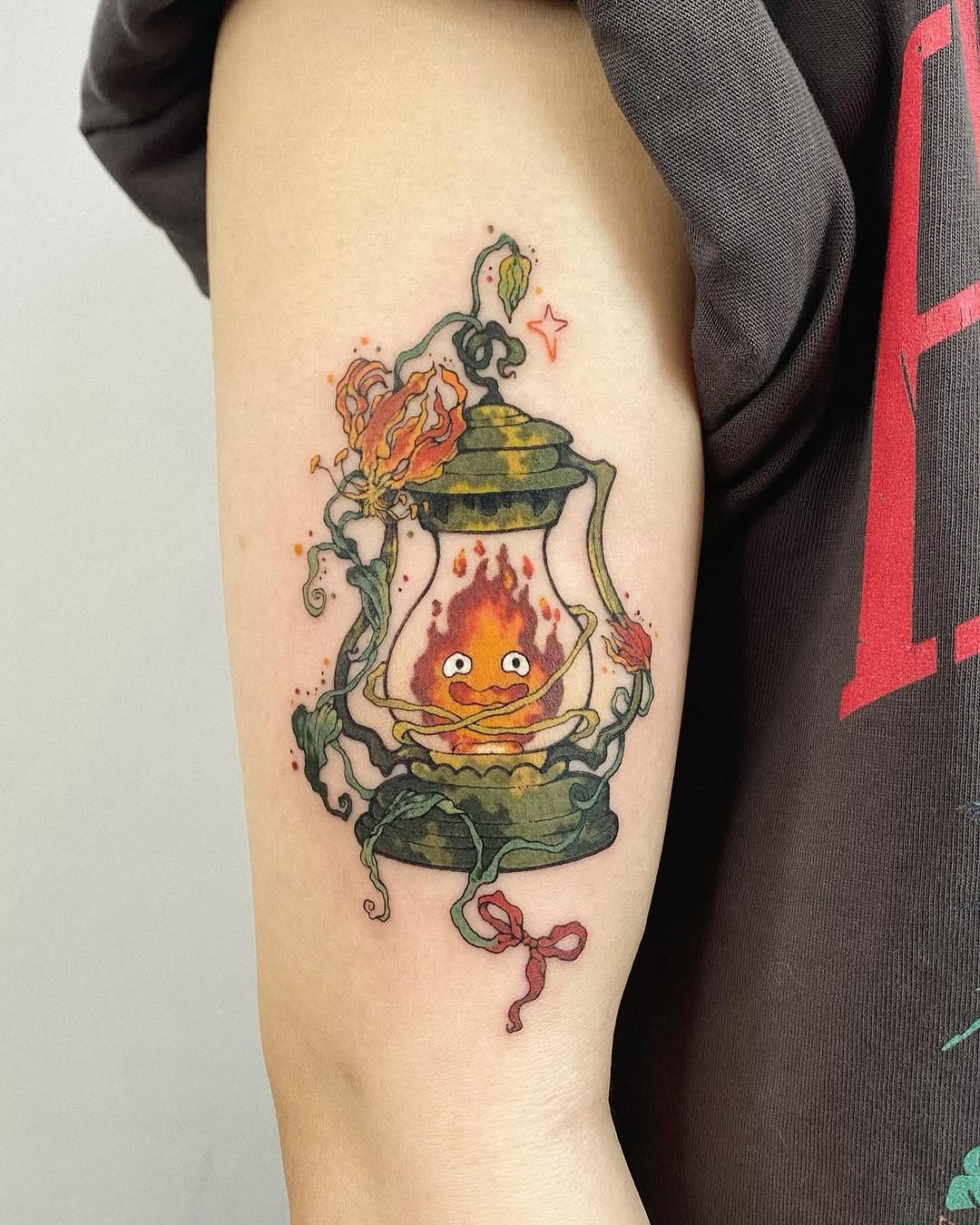 Charming lantern tattoo featuring a lively flame