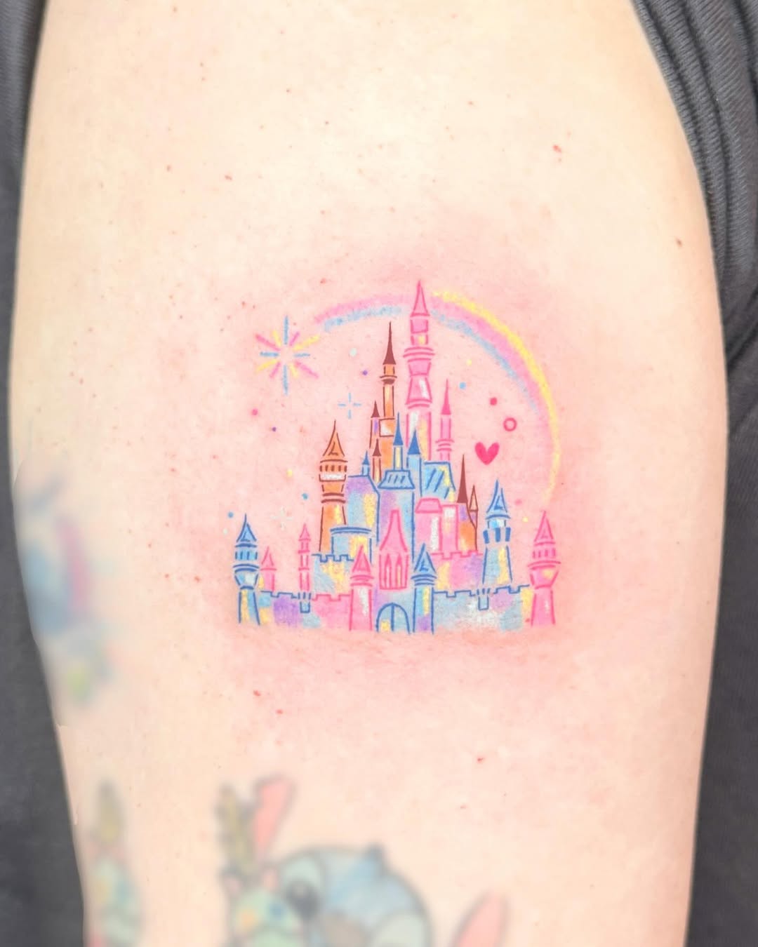 Charming pastel Disney castle tattoo design
