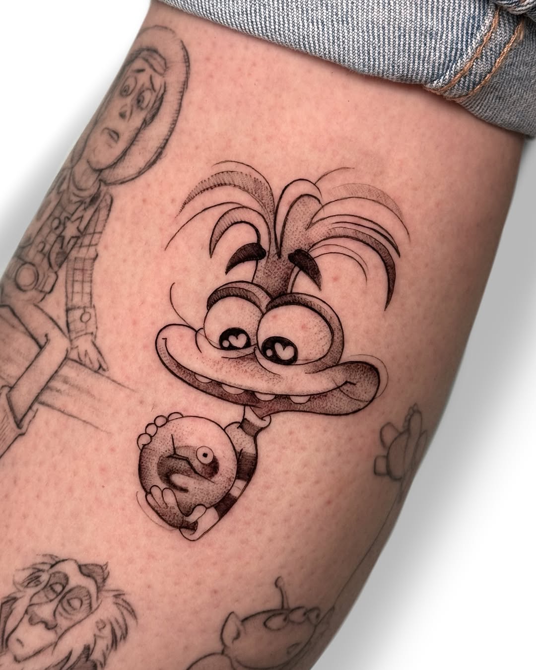 Whimsical Disney character tattoo design
