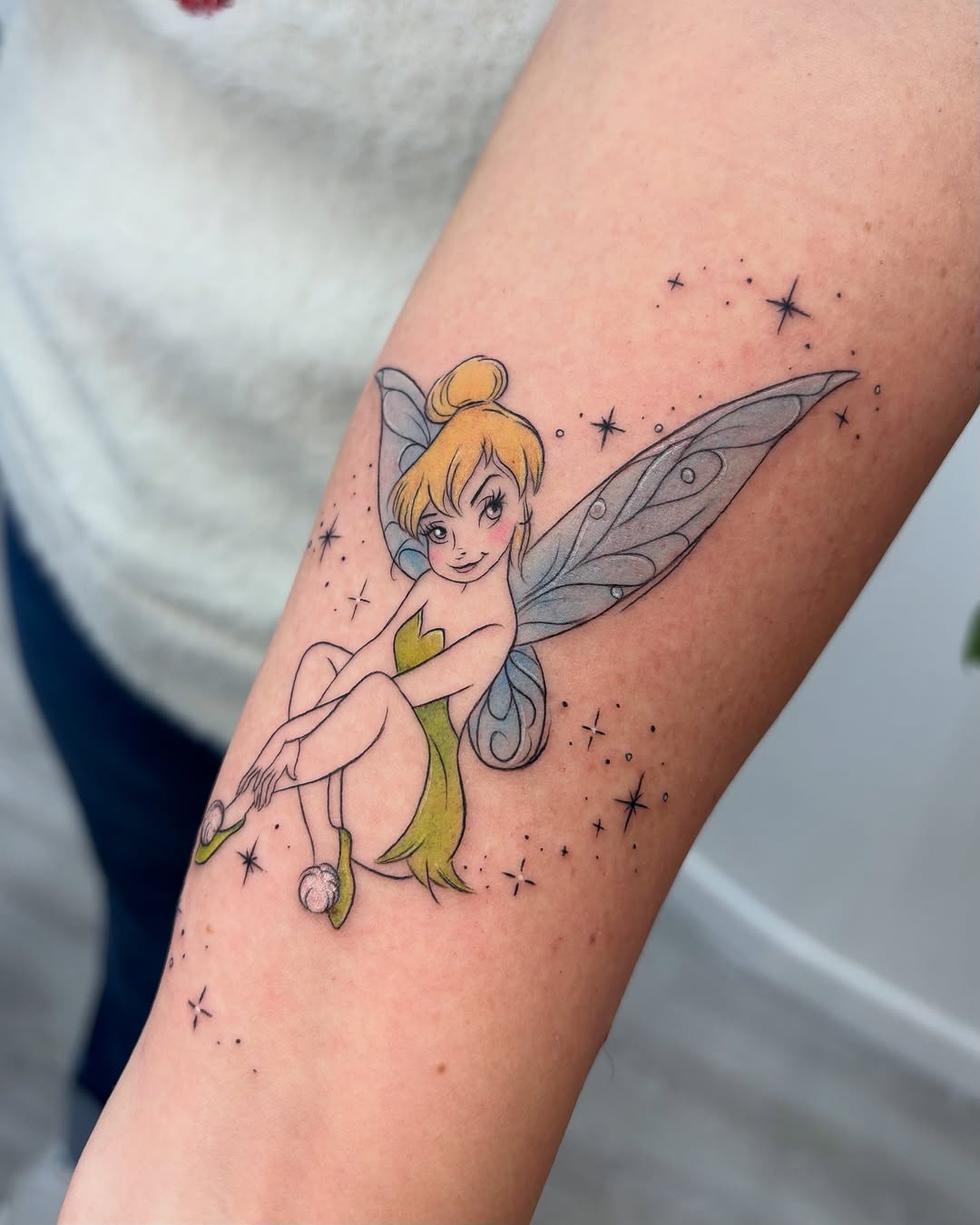 Charming Tinkerbell tattoo with sparkly accents