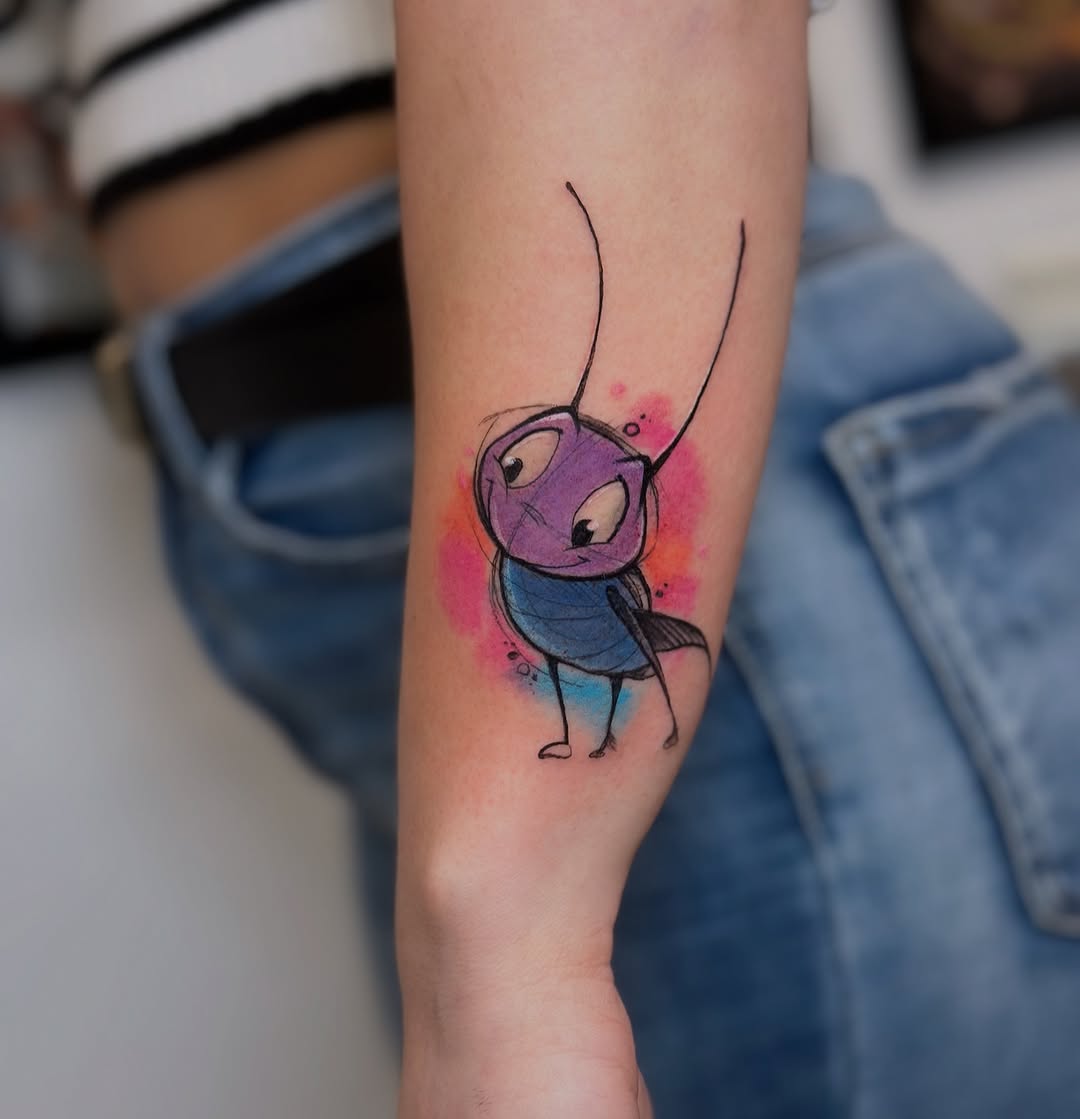 Vibrant tattoo of a whimsical cricket character