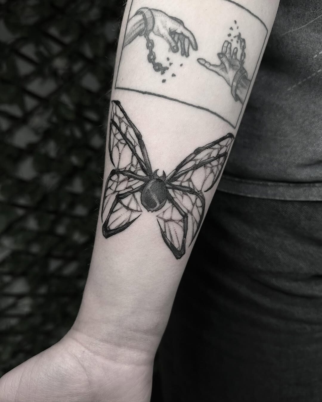 Intricate moth tattoo in gothic style