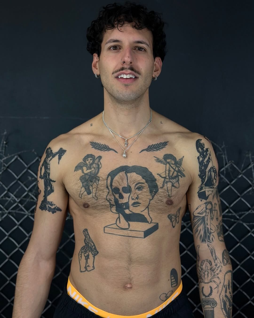 Dramatic male sleeve tattoo with gothic elements