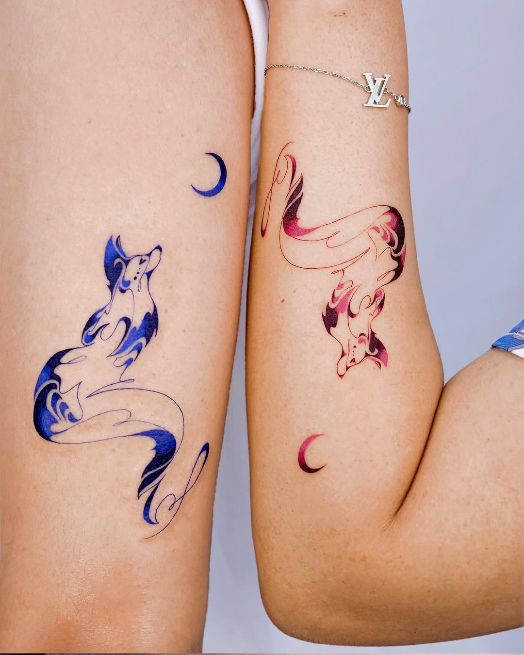 Colorful twin fox tattoos with mystical vibes
