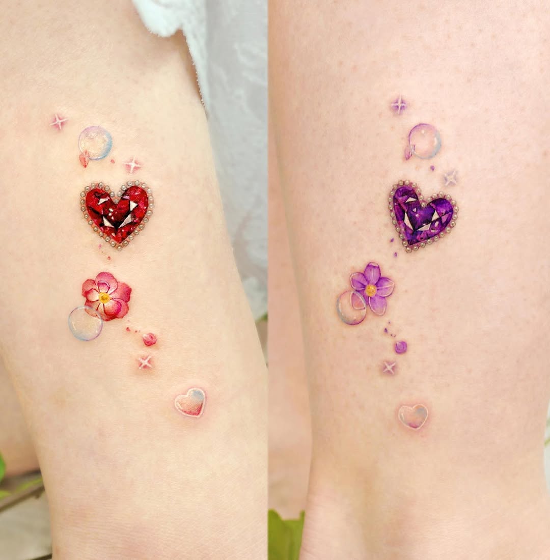 Stunning twin heart tattoos with floral accents
