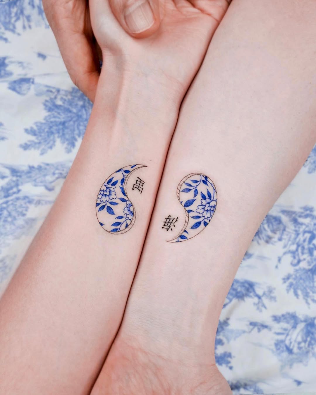Elegant twin tattoos symbolizing unity and balance