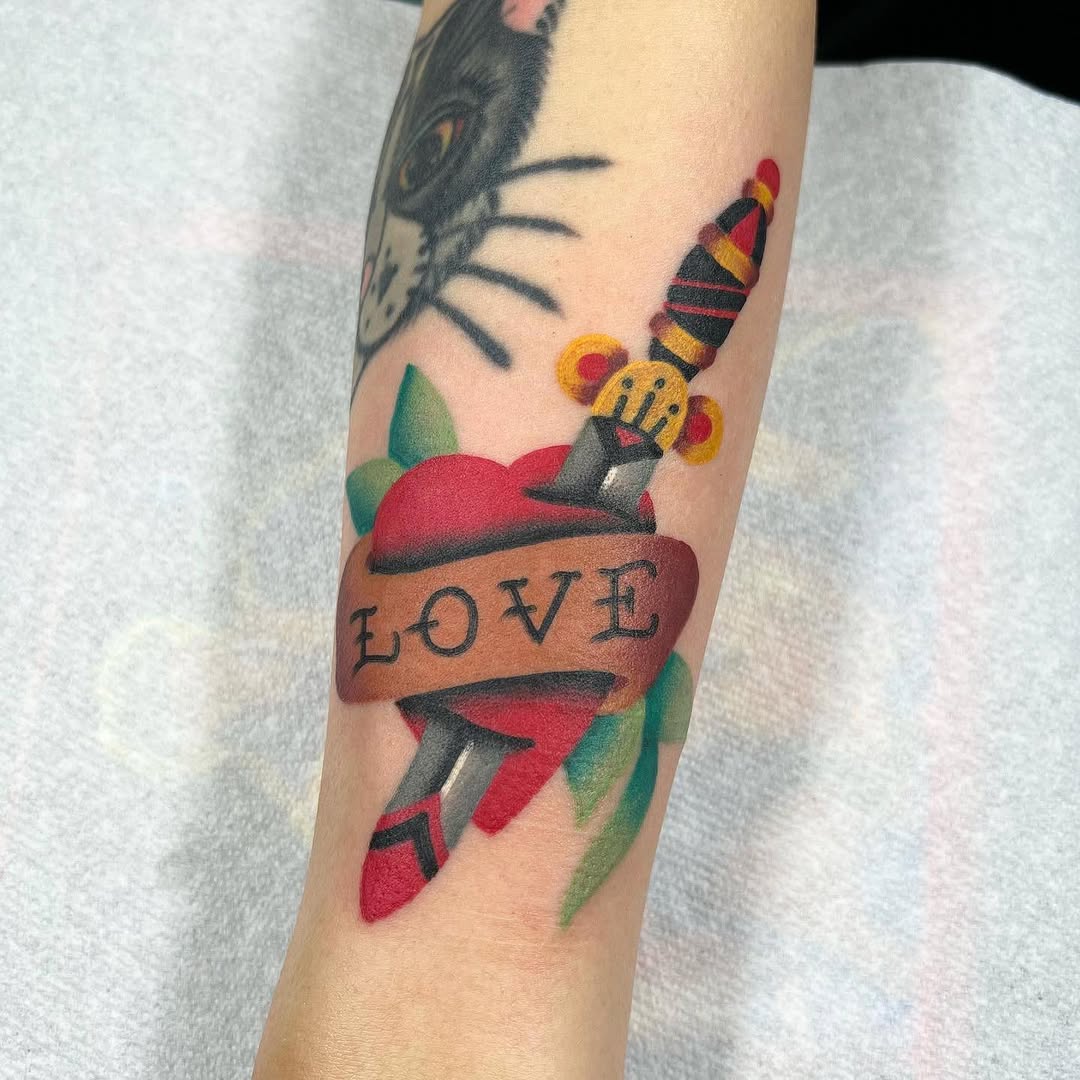 Colorful Dagger Through Heart Tattoo Design
