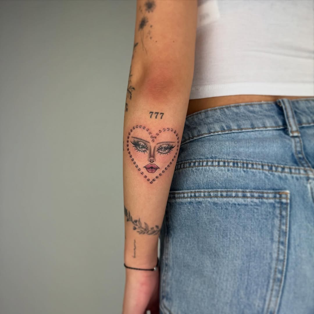 Unique heart-shaped face tattoo design