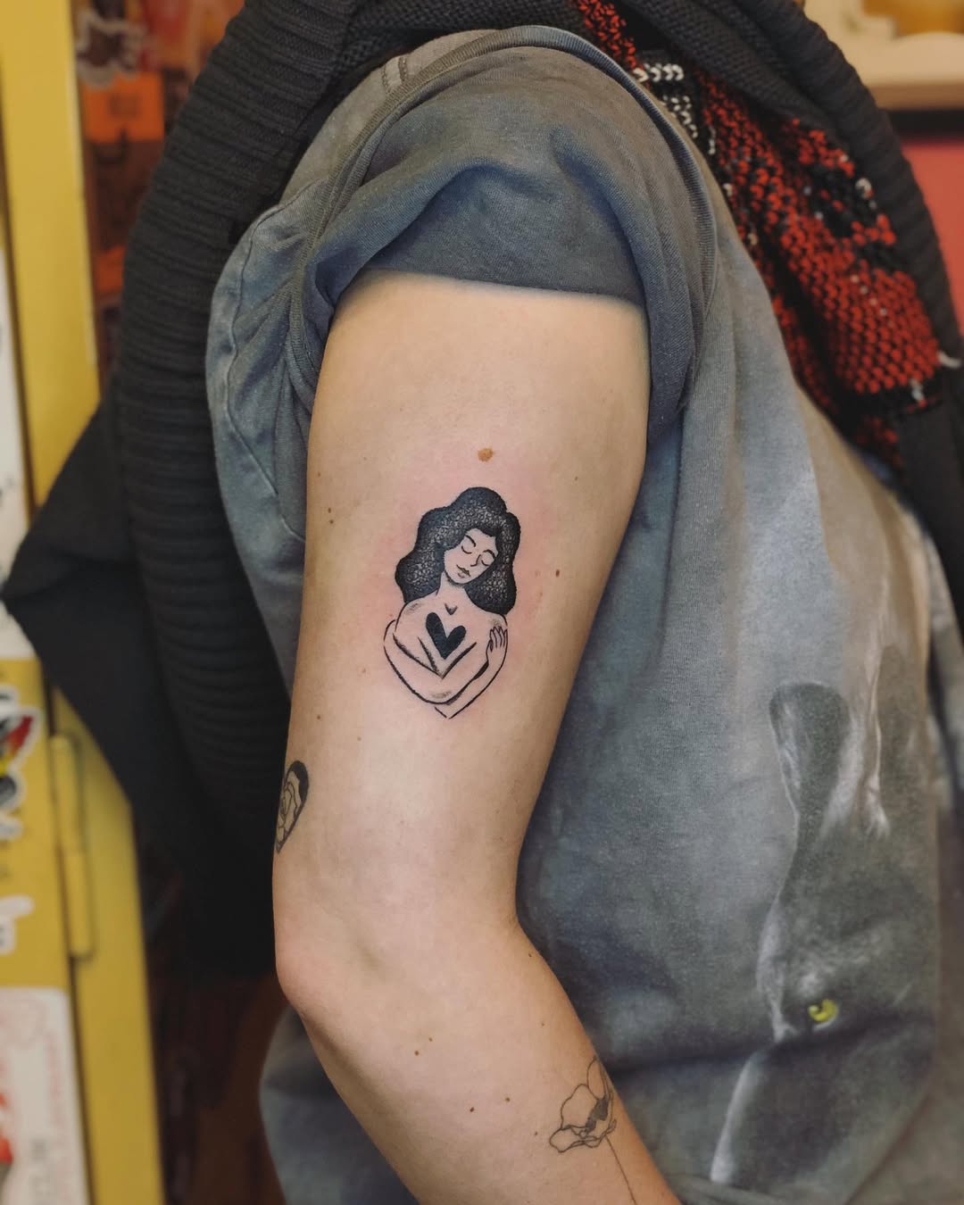 Elegant silhouette tattoo showcasing love and serenity