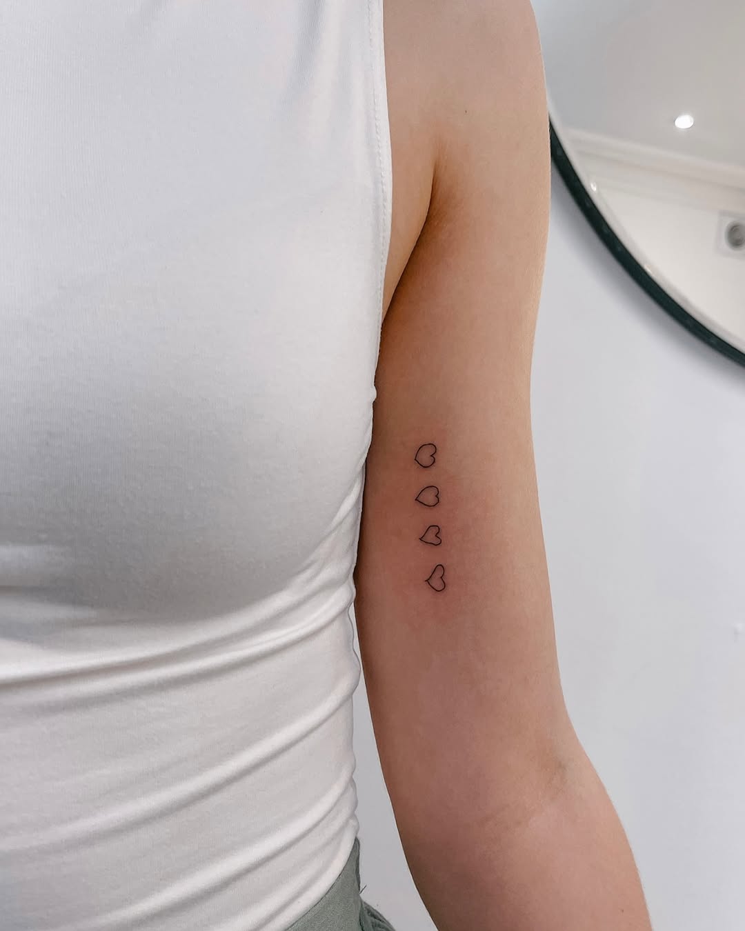 Minimalist hearts inked in delicate lines