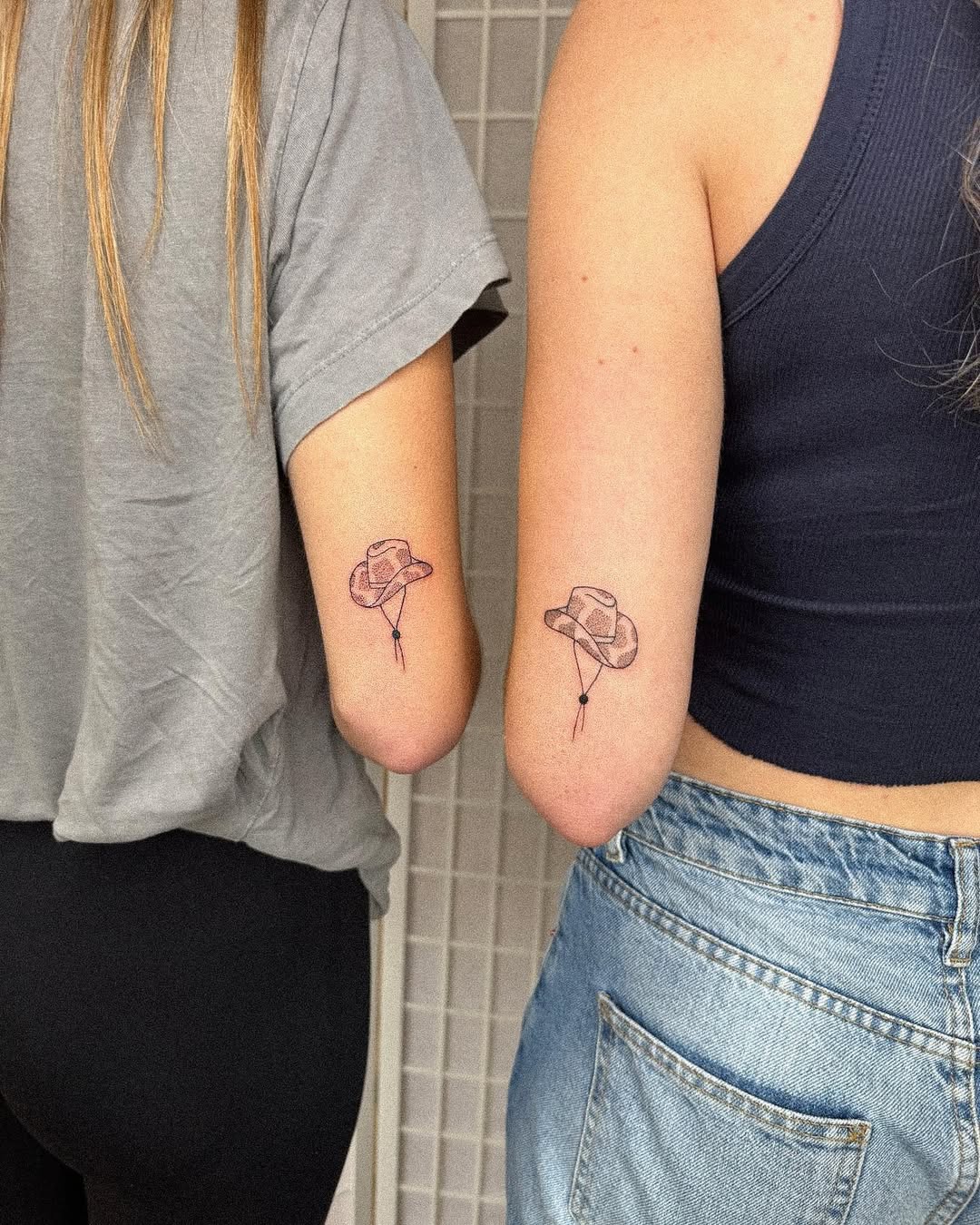 Matching cowboy hat tattoos for best friends