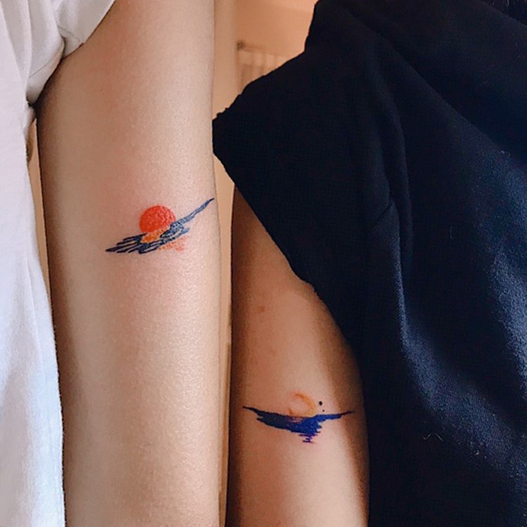 Symbolic sun and water best friend tattoos
