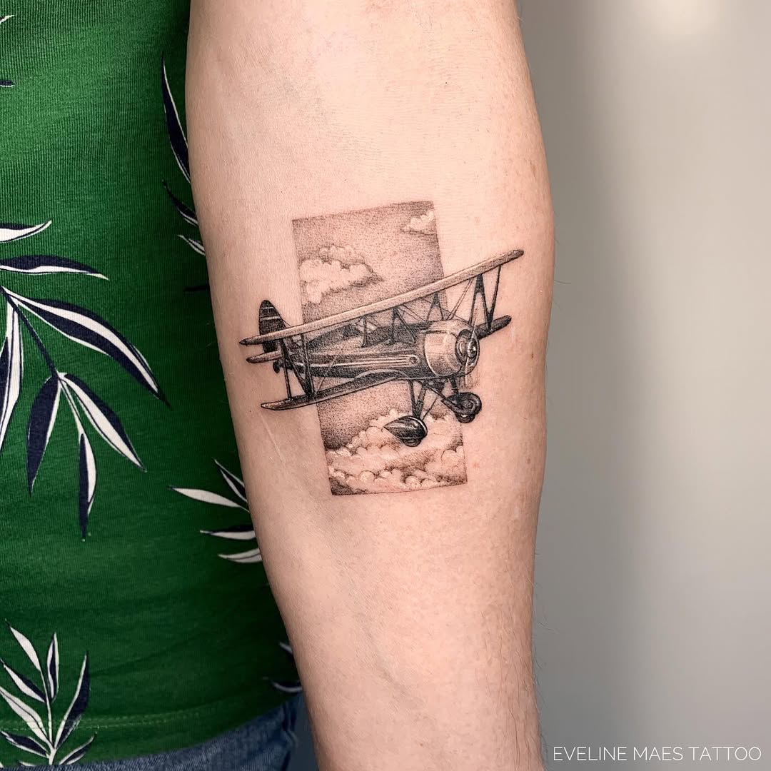 Stunning Vintage Airplane Tattoo with Clouds