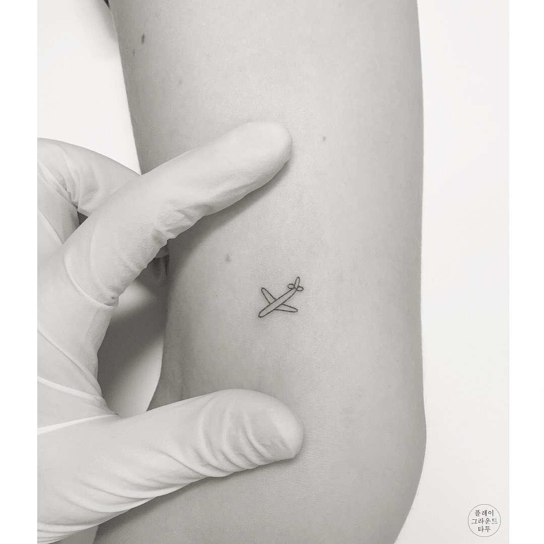 Chic Minimalist Airplane Tattoo Design