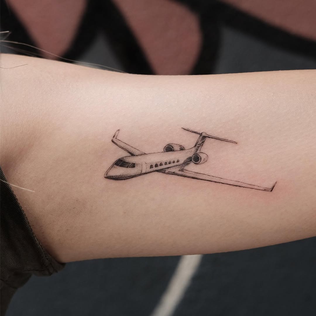 Minimalist airplane tattoo for aviation lovers