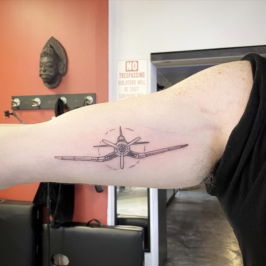 Elegant airplane tattoo showcasing vintage aesthetics
