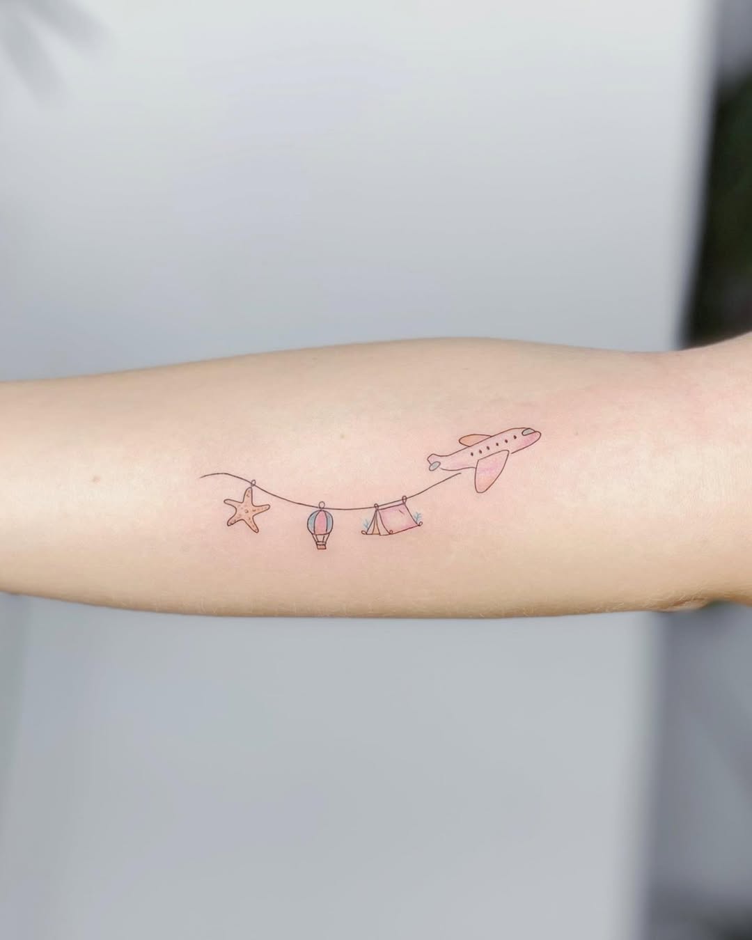 Charming airplane tattoo with nostalgic vibes