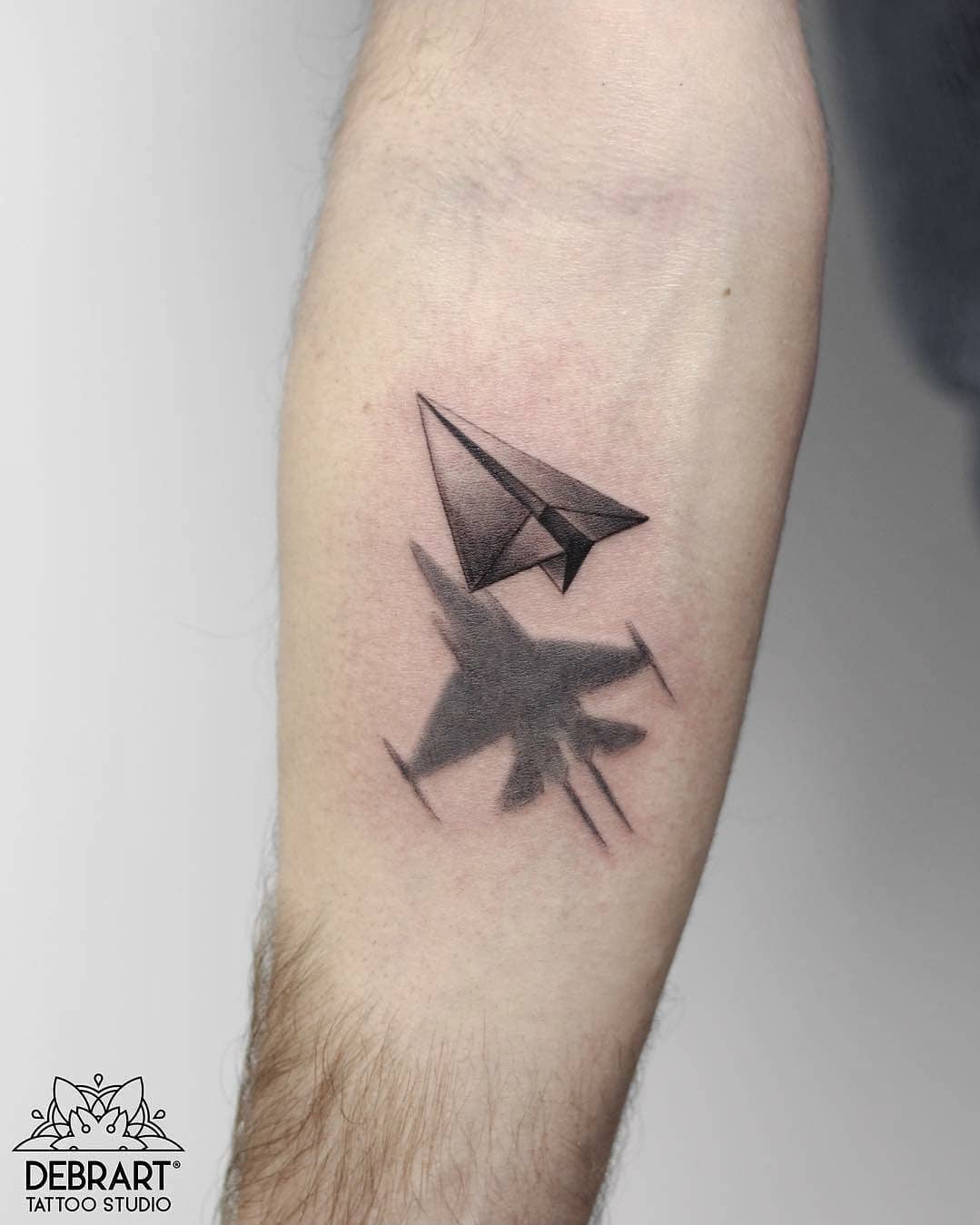 Unique jet and paper plane tattoo design