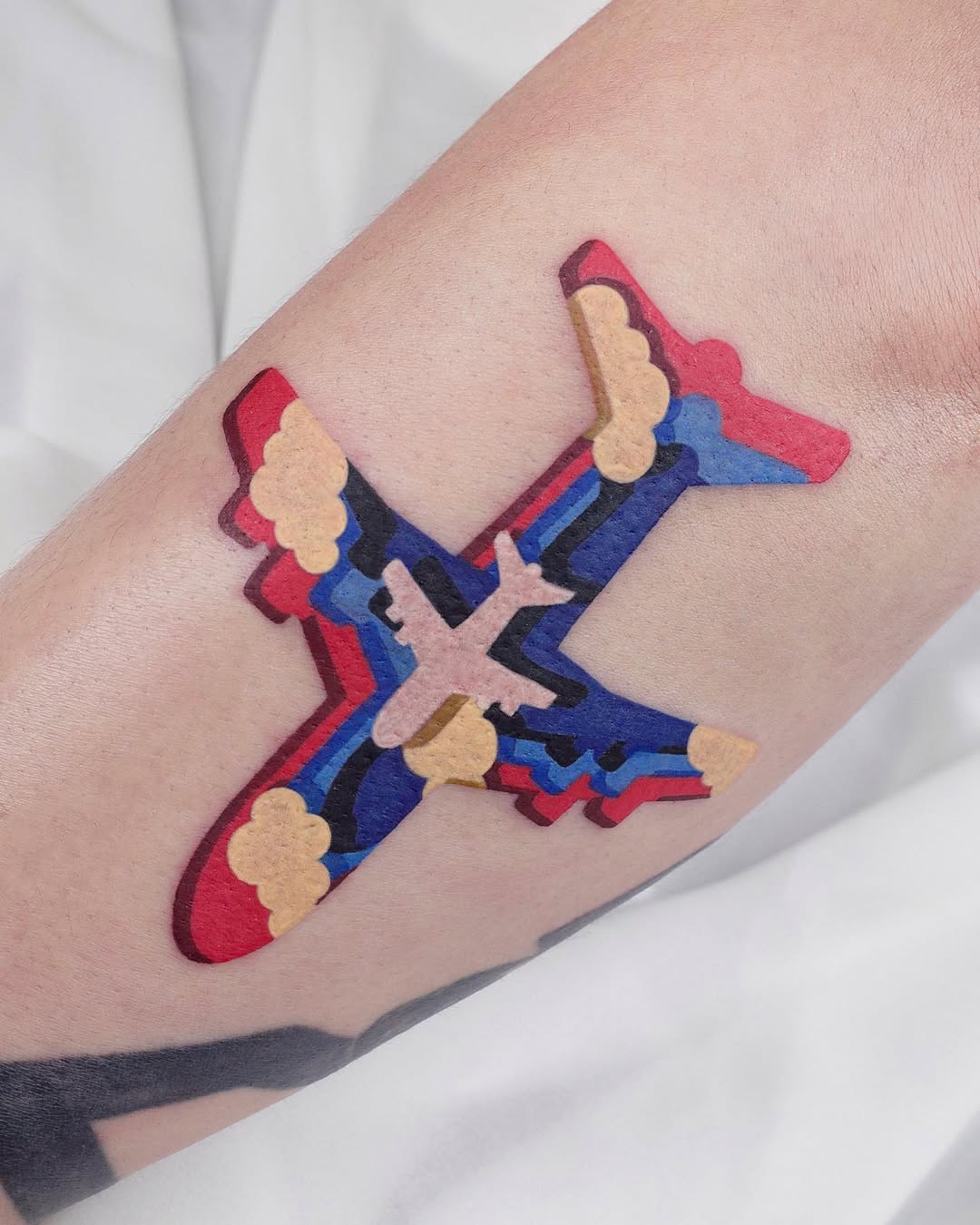 Vivid airplane tattoo showcasing unique artistry