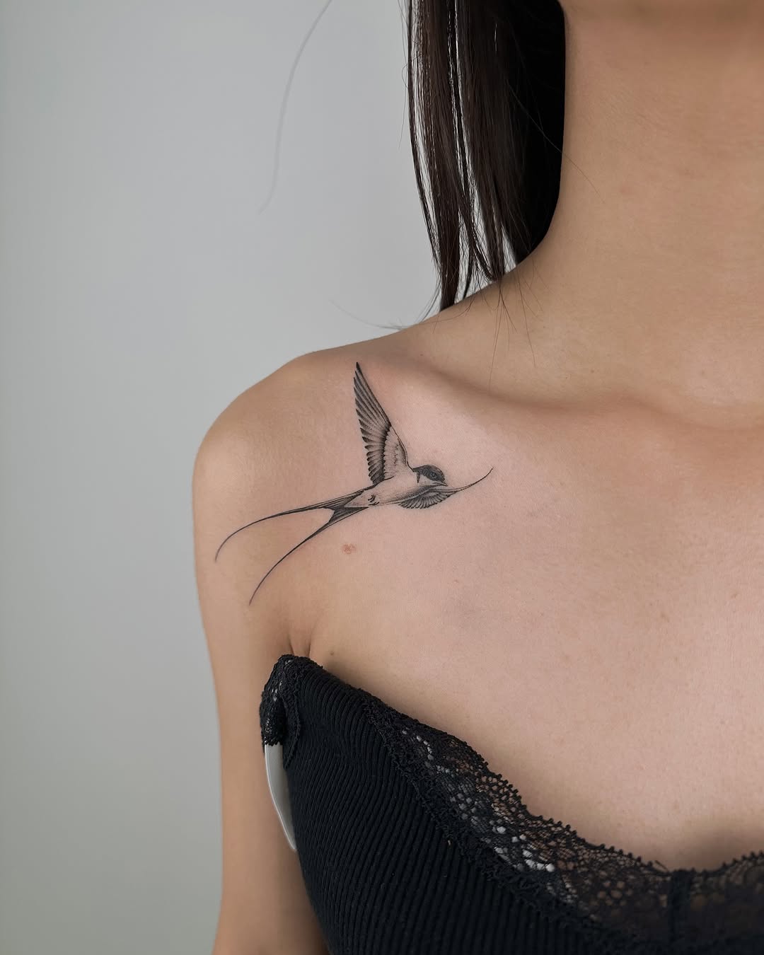 Elegant swallow tattoo capturing freedom and grace