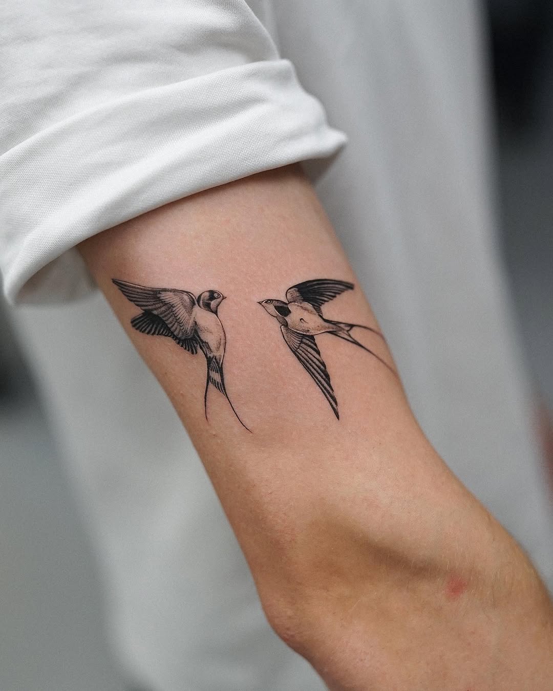 Elegant swallow tattoos capturing freedom and movement