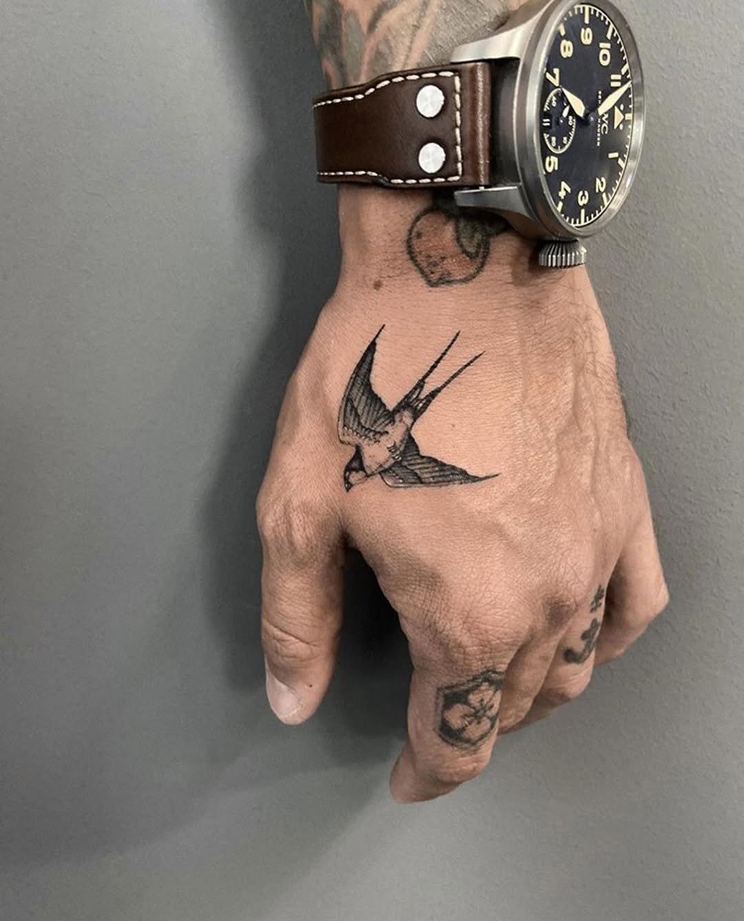 Elegant swallow tattoo on the hand