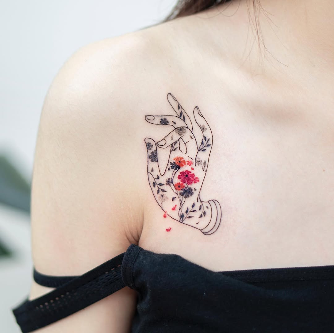 Feminine Floral Hand Tattoo with Vibrant Colors