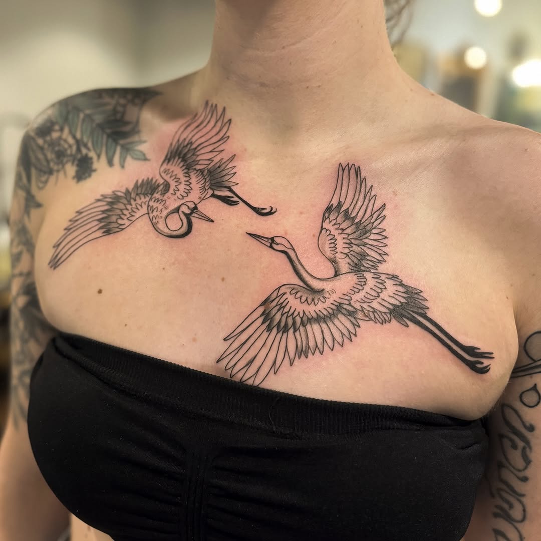 Elegant cranes soaring across the chest