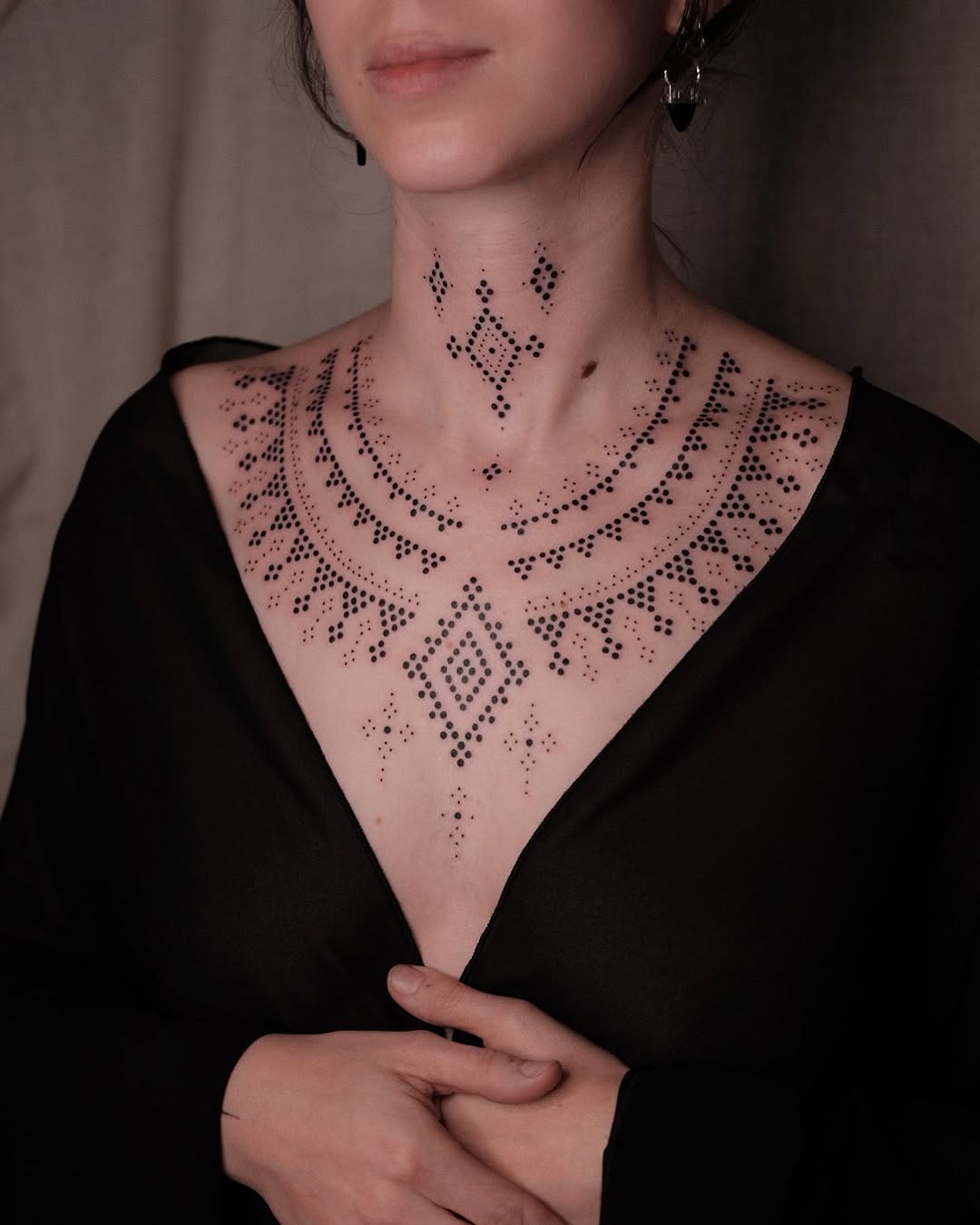 Intricate dotwork chest tattoo design