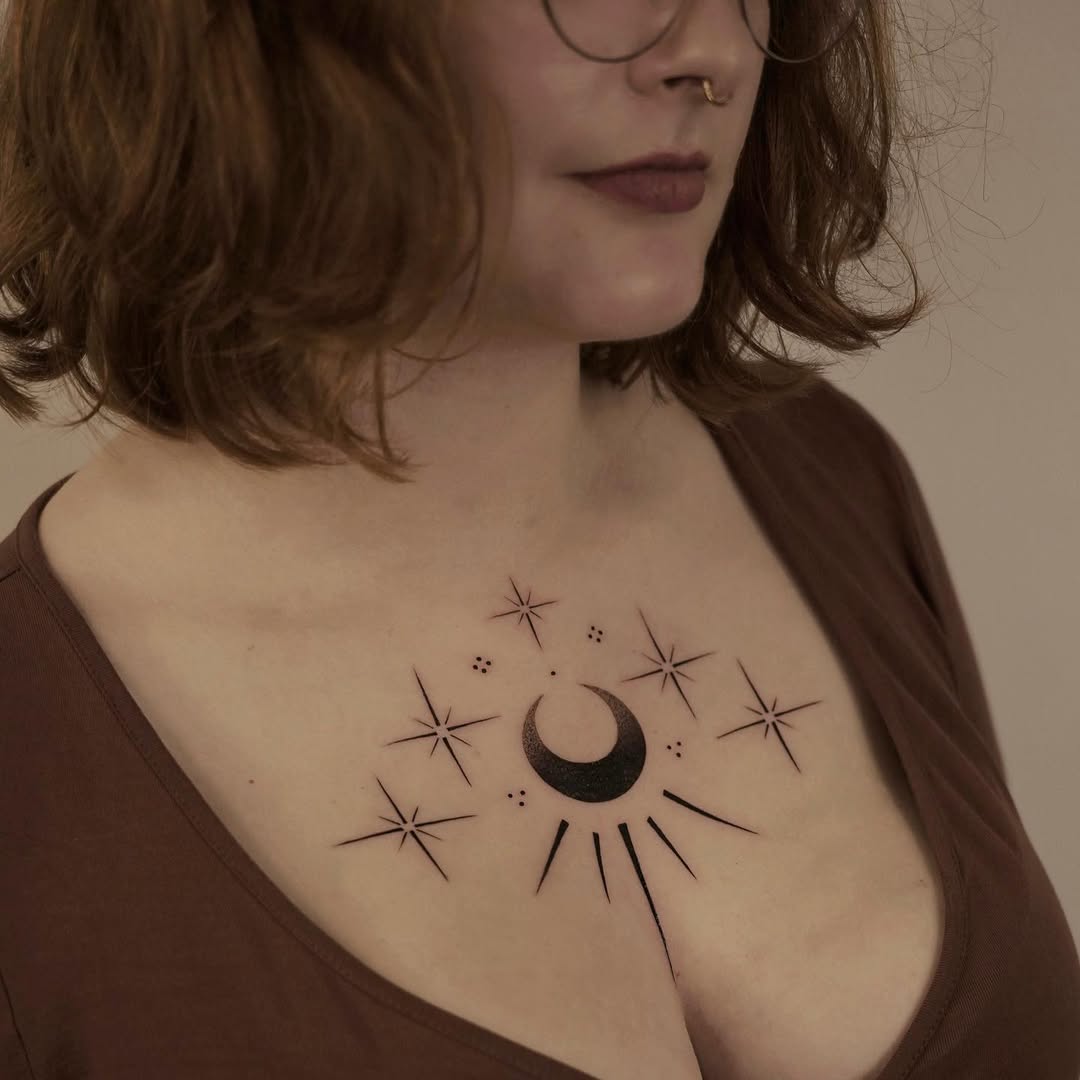 Elegant moon and star chest tattoo design
