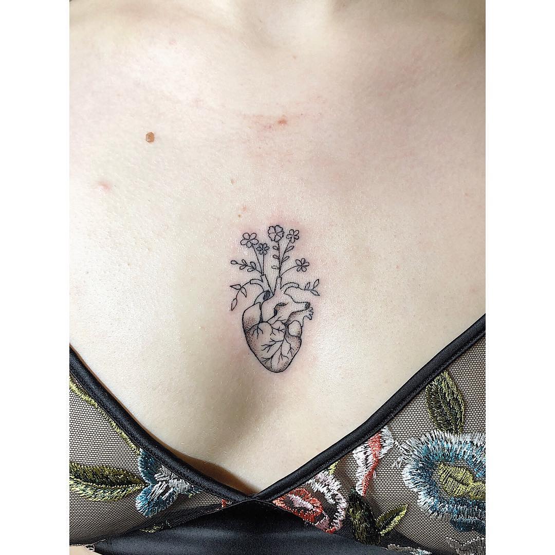 Intricate Floral Heart Chest Tattoo Design
