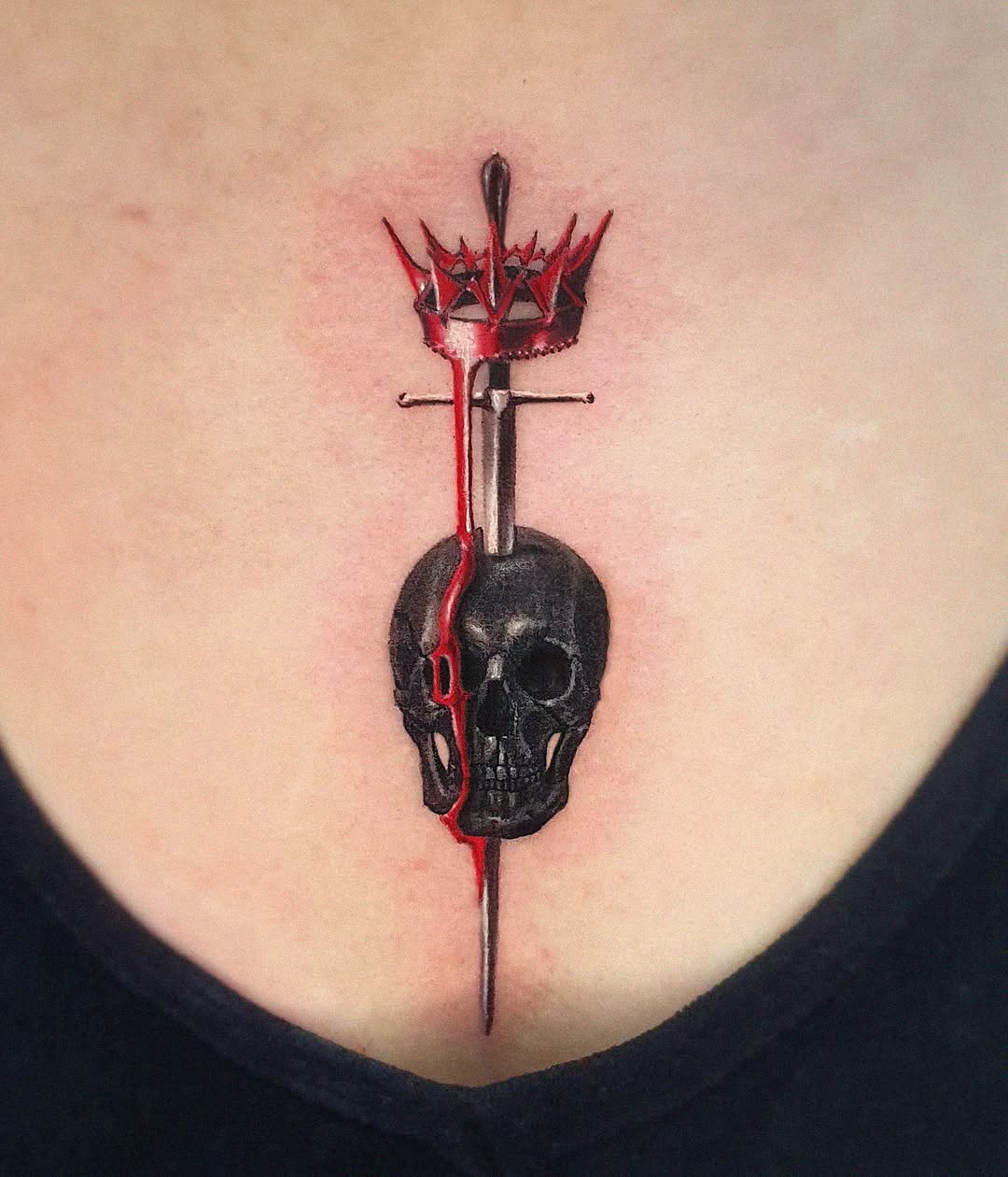 Striking skull and dagger chest tattoo design