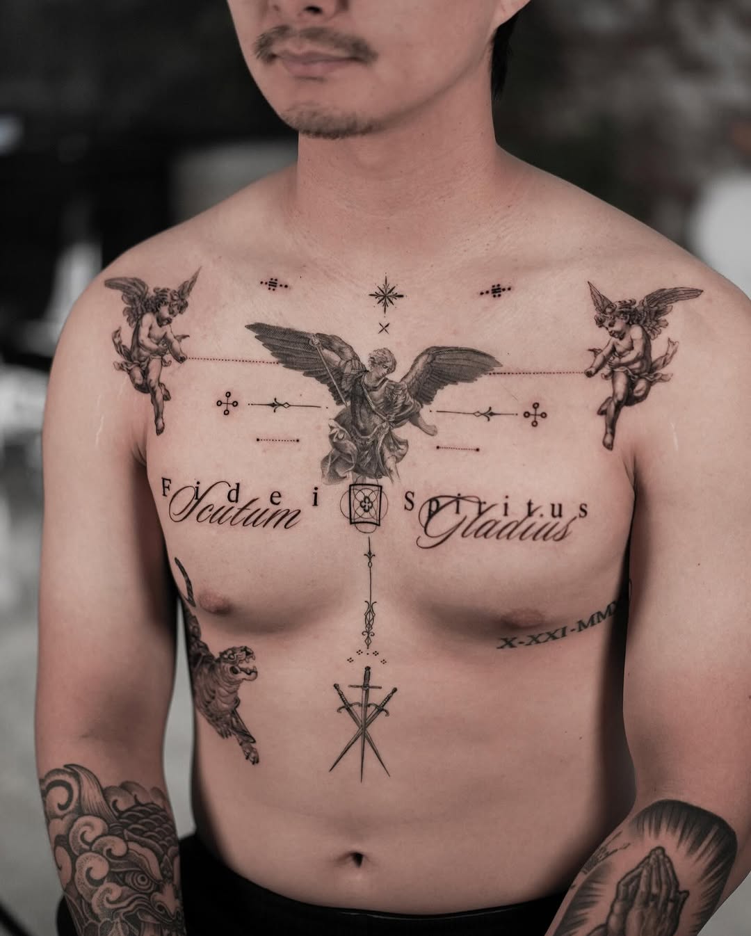 Bold Angelic Chest Tattoo with Intricate Details