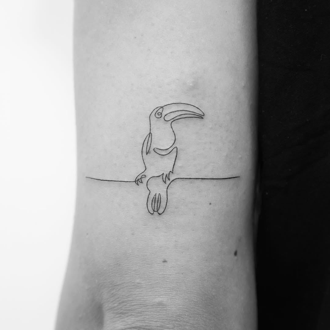Minimalist toucan tattoo for nature lovers