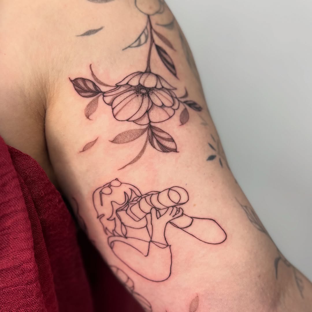 Captivating one-line camera tattoo design