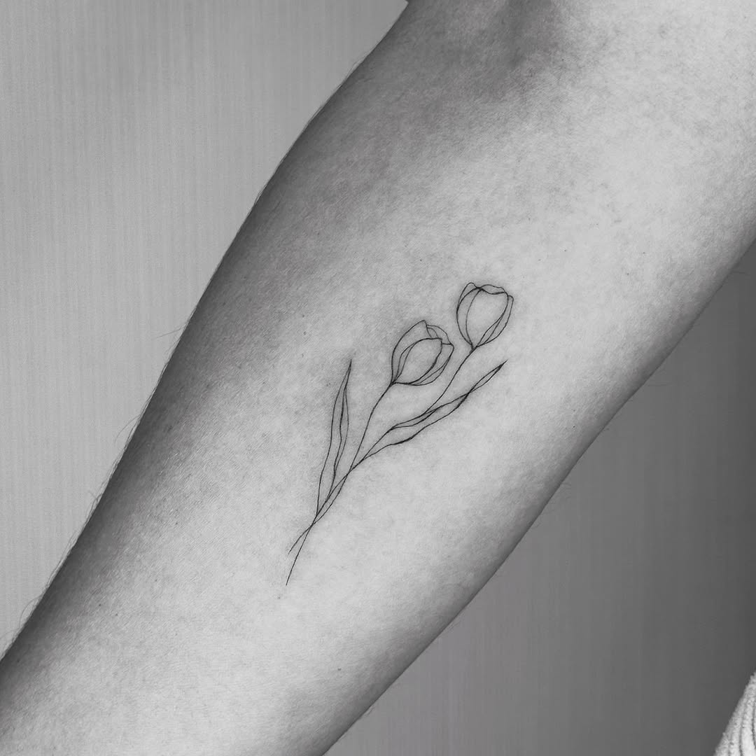 Minimalist floral tattoo in elegant line art
