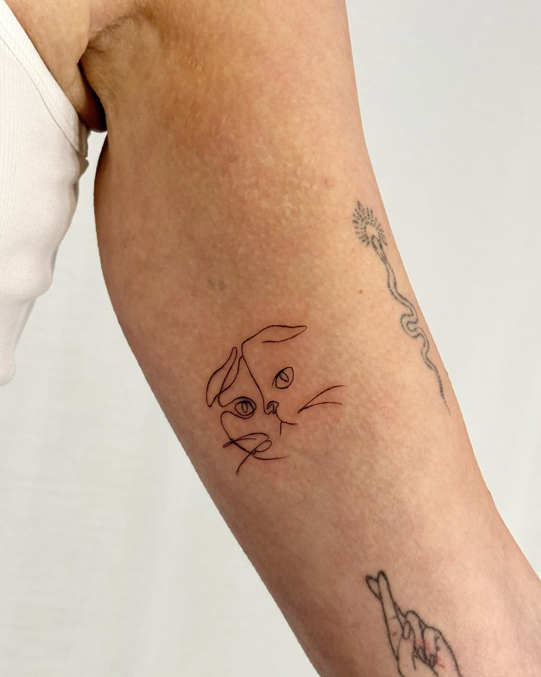 Charming Minimalist Cat Tattoo Design