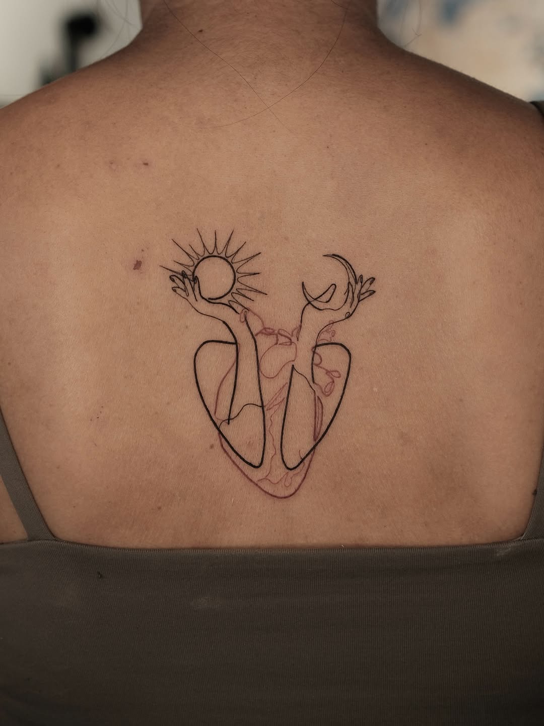 Tranquil one line sun and moon tattoo expression