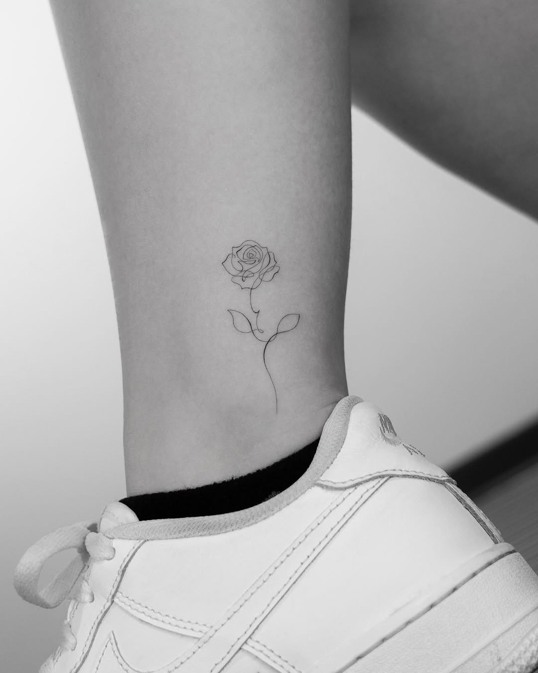 Delicate rose tattoo for minimalist enthusiasts